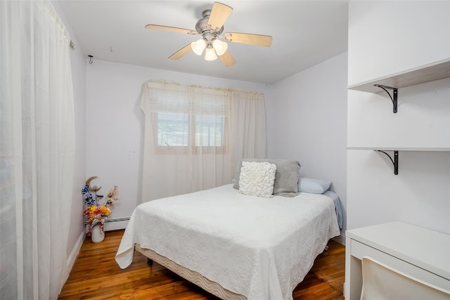 45 Broadview Dr, Commack, NY 11725 - bedroom featuring dark wood-type flooring, a baseboard heating unit, and a ceiling fan