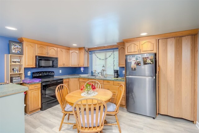 45 Broadview Dr, Commack, NY 11725 - kitchen with black appliances, light brown cabinetry, light wood finished floors, recessed lighting, and a sink