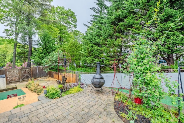 45 Broadview Dr, Commack, NY 11725 - fenced backyard featuring a patio area and view of scattered trees