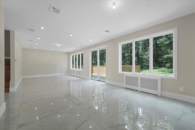 42 Greycourt Rd, Chester, NY 10918 - spare room with light marble finish flooring, baseboards, radiator, and recessed lighting