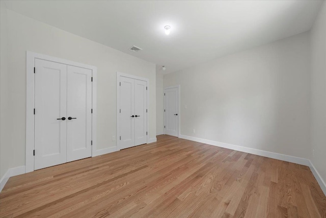 42 Greycourt Rd, Chester, NY 10918 - unfurnished bedroom with two closets, light wood-style flooring, and baseboards
