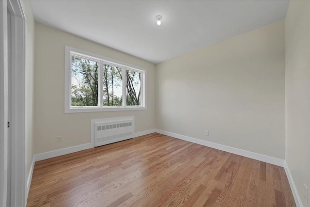 42 Greycourt Rd, Chester, NY 10918 - spare room with radiator heating unit, light wood-type flooring, and baseboards