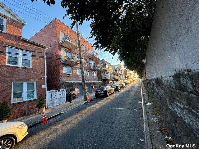 94-68 45th Ave, Elmhurst, NY 11373 - view of road featuring sidewalks and curbs