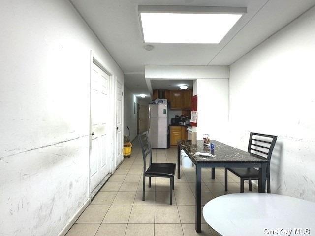 94-68 45th Ave, Elmhurst, NY 11373 - dining space with light tile patterned flooring