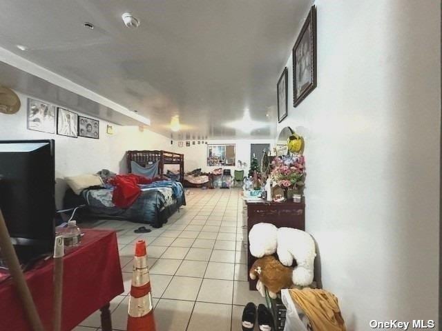 94-68 45th Ave, Elmhurst, NY 11373 - bedroom with tile patterned flooring