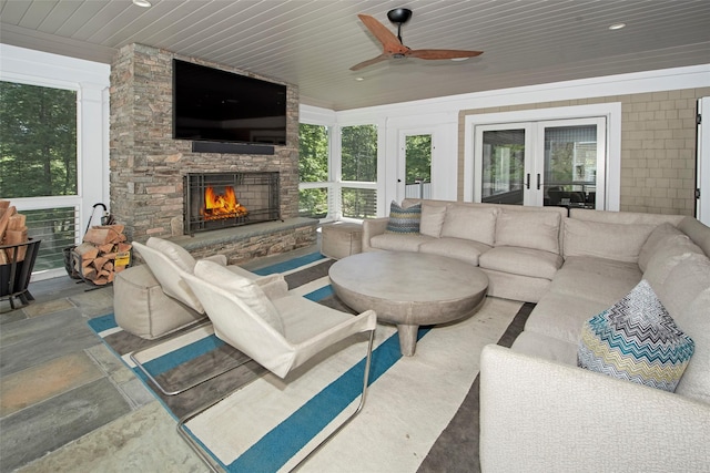 93 Haights Cross Rd, Chappaqua, NY 10514 - living area with a fireplace, healthy amount of natural light, ceiling fan, french doors, and wooden ceiling