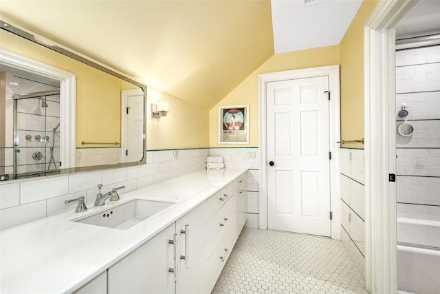 93 Haights Cross Rd, Chappaqua, NY 10514 - bathroom featuring tile walls, vanity, a shower with door, a wainscoted wall, and vaulted ceiling