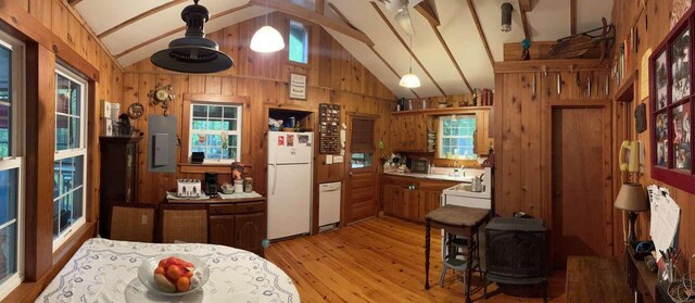 3 Perry Rd, Barryville, NY 12719 - kitchen with white appliances, wood walls, light wood finished floors, beam ceiling, and electric panel