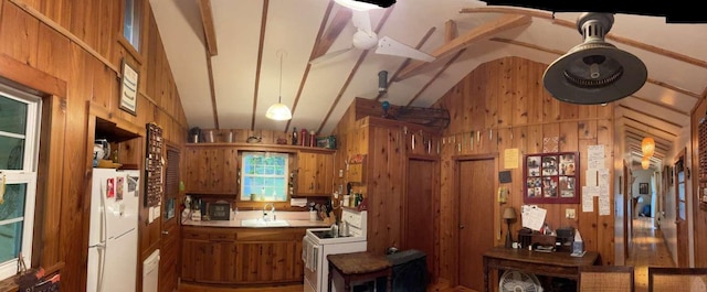 3 Perry Rd, Barryville, NY 12719 - kitchen featuring white appliances, brown cabinets, wooden walls, a sink, and high vaulted ceiling