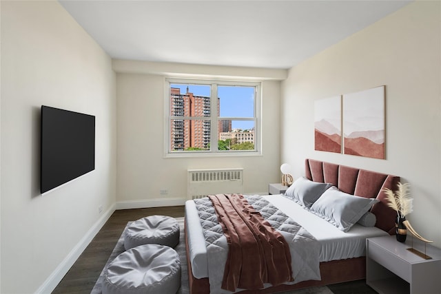 825 Morrison Ave Unit 5H, Bronx, NY 10473 - bedroom with radiator heating unit, wood finished floors, and baseboards
