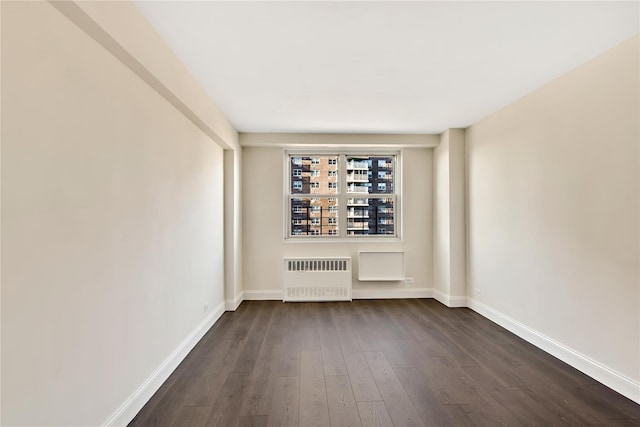 825 Morrison Ave Unit 5H, Bronx, NY 10473 - empty room featuring radiator, dark wood-style flooring, and baseboards