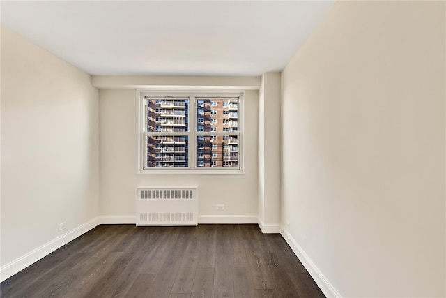 825 Morrison Ave Unit 5H, Bronx, NY 10473 - unfurnished room featuring radiator, dark wood finished floors, and baseboards