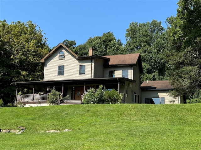 459 Illington Rd, Ossining, NY 10562 - view of front of property featuring covered porch, a chimney, and a front lawn