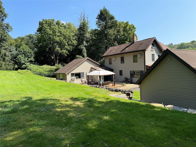 459 Illington Rd, Ossining, NY 10562 - back of property with a gazebo, a chimney, a yard, and a patio area