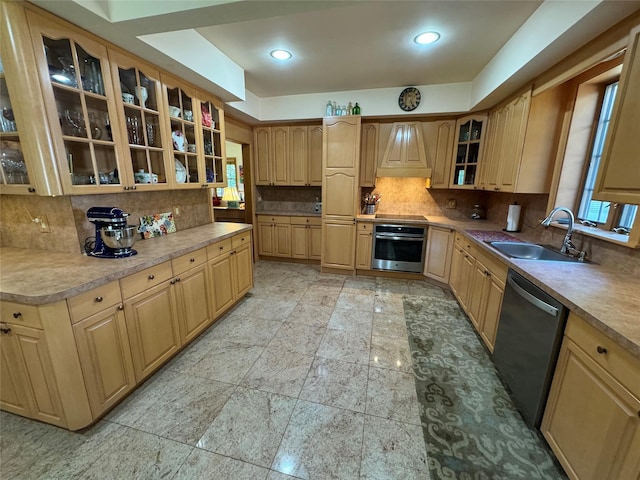 459 Illington Rd, Ossining, NY 10562 - kitchen featuring stainless steel appliances, a sink, tasteful backsplash, glass insert cabinets, and light countertops