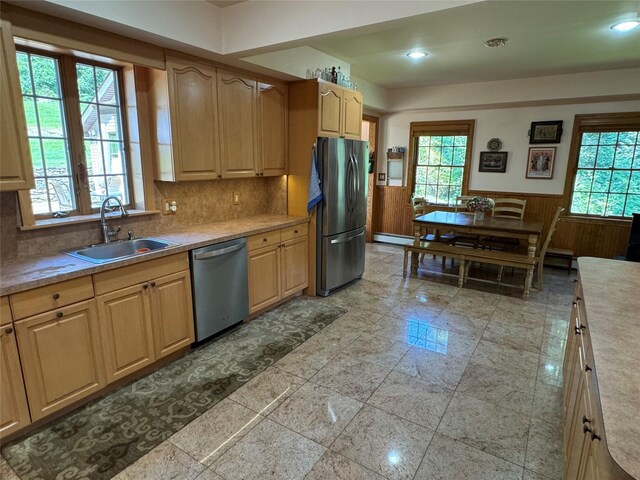 459 Illington Rd, Ossining, NY 10562 - kitchen with appliances with stainless steel finishes, a sink, wainscoting, healthy amount of natural light, and light countertops