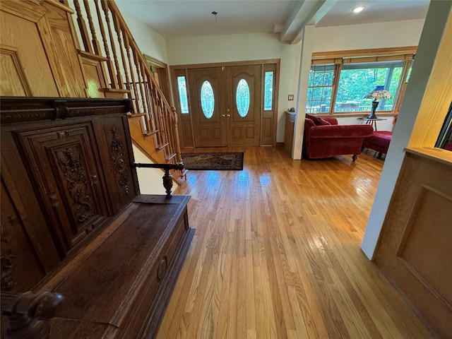 459 Illington Rd, Ossining, NY 10562 - entryway with light wood-style floors, stairway, and beam ceiling