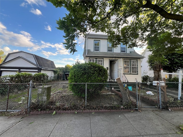 55-08 Haspel St, Elmhurst, NY 11373 - view of front of home featuring a fenced front yard and a gate