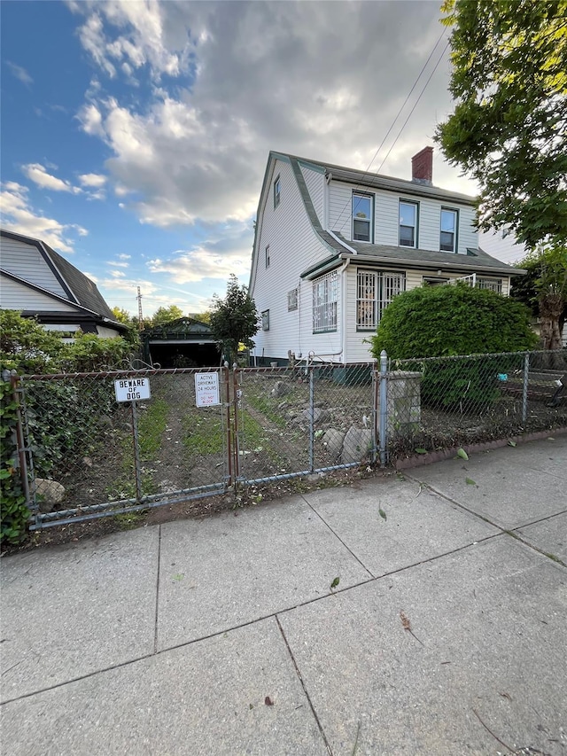 55-08 Haspel St, Elmhurst, NY 11373 - view of property exterior featuring a fenced front yard, a chimney, and a gate