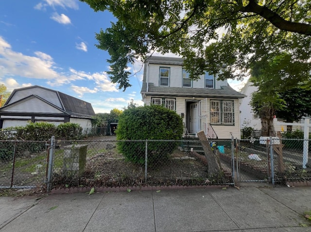 55-08 Haspel St, Elmhurst, NY 11373 - traditional home with a gate and a fenced front yard