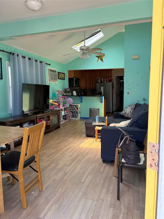 75 Wisconsin St, Long Beach, NY 11561 - living room featuring vaulted ceiling, light wood finished floors, a ceiling fan, and a wall mounted AC