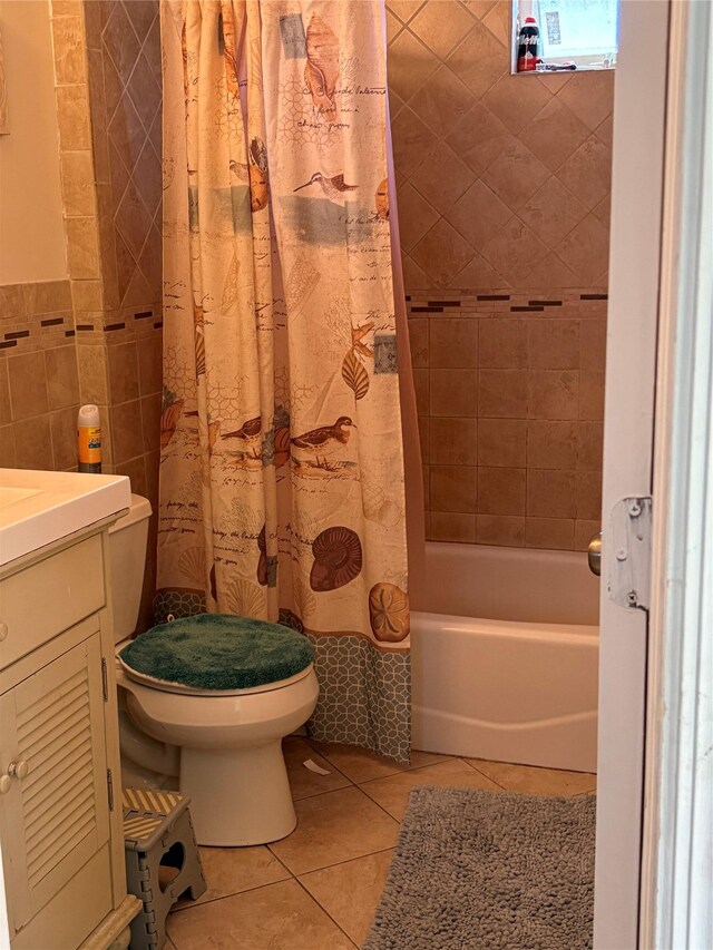75 Wisconsin St, Long Beach, NY 11561 - full bath with tile patterned floors, shower / bathtub combination with curtain, toilet, vanity, and tile walls