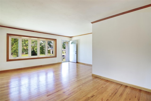 21 Rita Cres, Commack, NY 11725 - empty room featuring crown molding, baseboards, and light wood finished floors