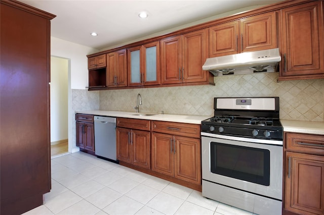 21 Rita Cres, Commack, NY 11725 - kitchen with stainless steel gas range, under cabinet range hood, dishwashing machine, a sink, and light countertops
