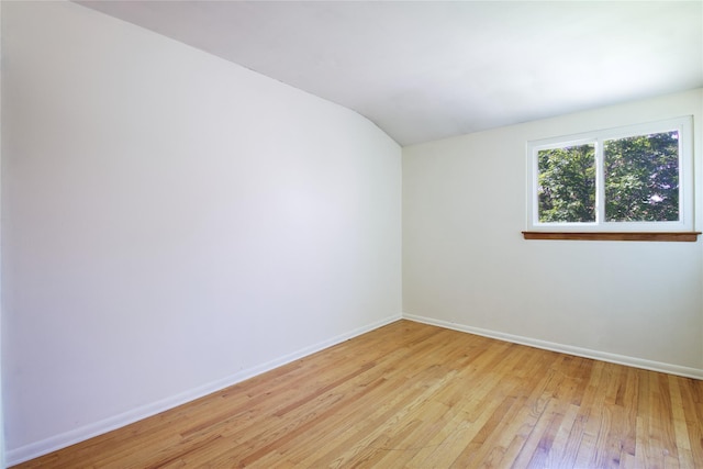 21 Rita Cres, Commack, NY 11725 - unfurnished room with lofted ceiling, light wood-style floors, and baseboards