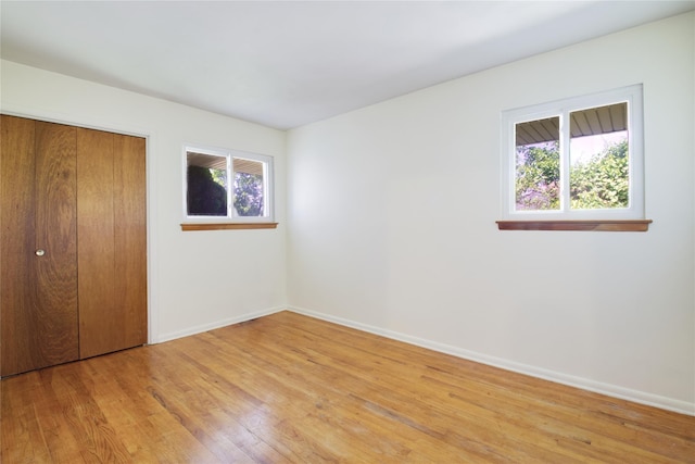 21 Rita Cres, Commack, NY 11725 - unfurnished bedroom with light wood-type flooring, baseboards, and a closet