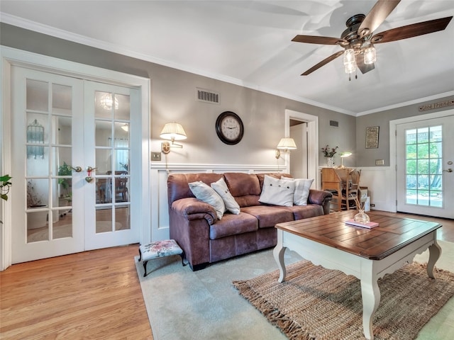 20 Tusten Ave, Goshen, NY 10924 - living area featuring french doors, wood finished floors, a ceiling fan, and ornamental molding