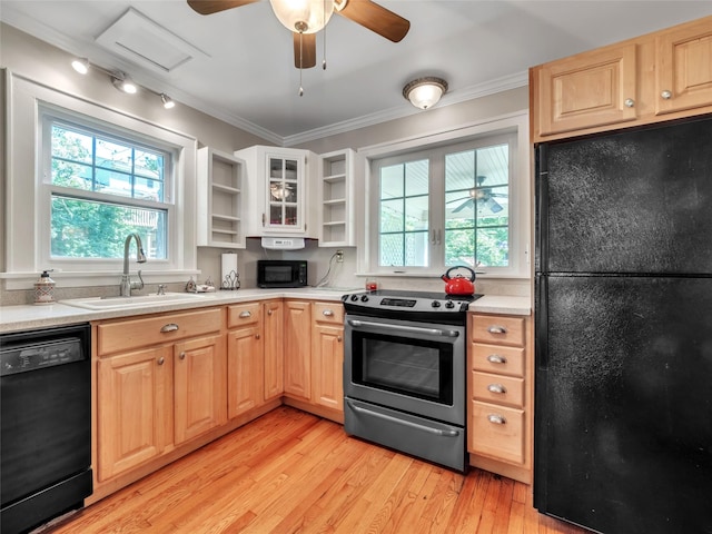 20 Tusten Ave, Goshen, NY 10924 - kitchen featuring black appliances, open shelves, a sink, light wood finished floors, and light brown cabinets