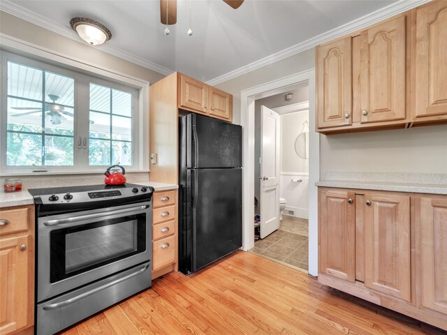 20 Tusten Ave, Goshen, NY 10924 - kitchen with electric stove, freestanding refrigerator, light brown cabinetry, ceiling fan, and ornamental molding