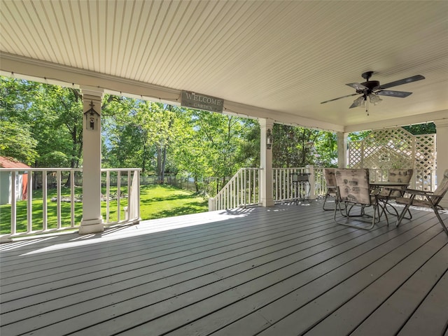 20 Tusten Ave, Goshen, NY 10924 - wooden deck featuring a ceiling fan, outdoor dining area, and view of wooded area