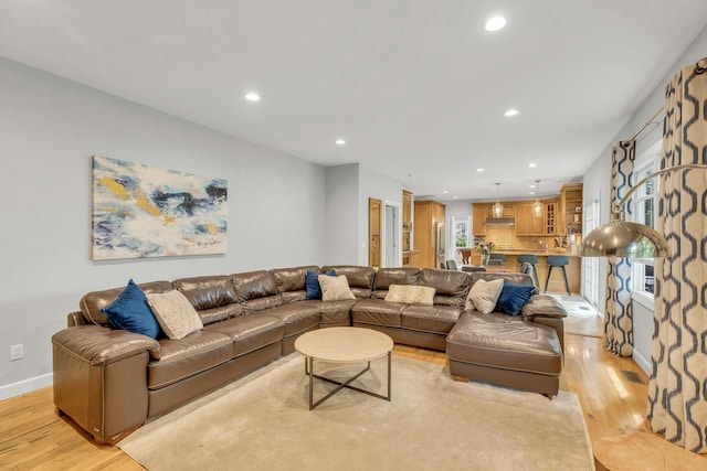 6 Esteves Ct, Melville, NY 11747 - living area featuring light wood finished floors, recessed lighting, and baseboards