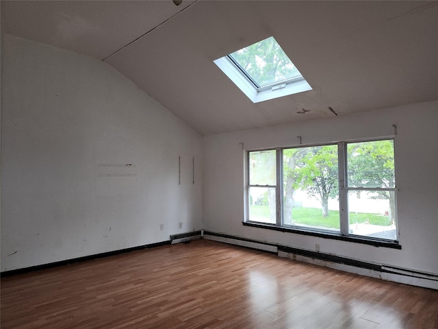 36 S 23rd St, Wyandanch, NY 11798 - unfurnished room featuring vaulted ceiling, a skylight, wood finished floors, and a baseboard radiator