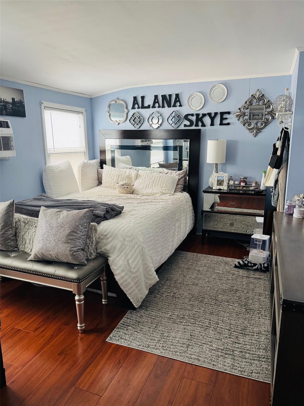 28 Brower Ave, Woodmere, NY 11598 - bedroom featuring wood finished floors, ornamental molding, and a wall mounted AC