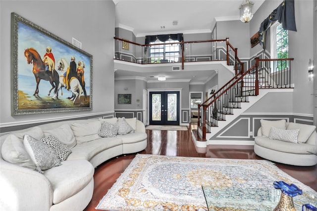 8 Wisteria Ln, Lake Grove, NY 11755 - living area featuring crown molding, stairway, french doors, a high ceiling, and wood finished floors