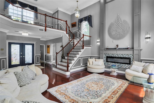 8 Wisteria Ln, Lake Grove, NY 11755 - foyer with stairway, a towering ceiling, wood finished floors, french doors, and a tiled fireplace