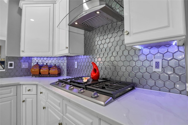 8 Wisteria Ln, Lake Grove, NY 11755 - kitchen featuring wall chimney range hood, stainless steel gas stovetop, light countertops, and white cabinets