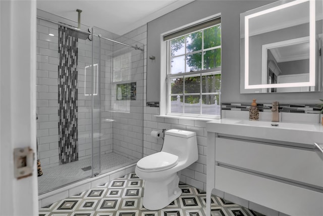 8 Wisteria Ln, Lake Grove, NY 11755 - bathroom featuring vanity, toilet, a stall shower, tile walls, and tile patterned floors