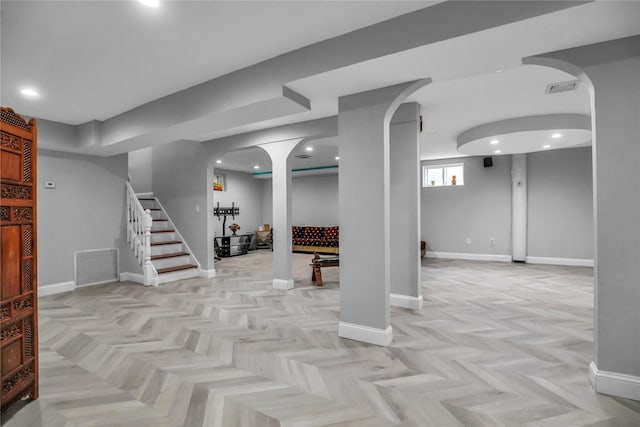 8 Wisteria Ln, Lake Grove, NY 11755 - basement featuring baseboards, stairway, recessed lighting, and arched walkways