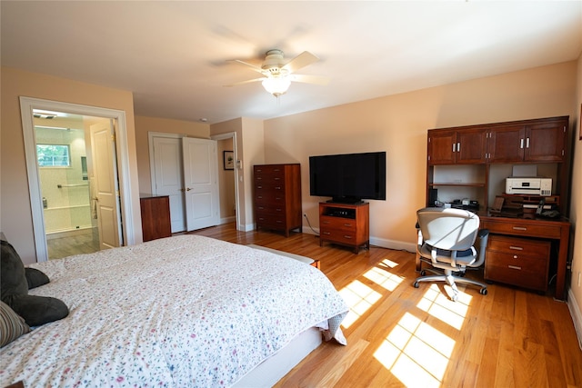 14 Gordon Ave, Plainview, NY 11803 - bedroom with light wood finished floors, a desk, baseboards, connected bathroom, and a ceiling fan