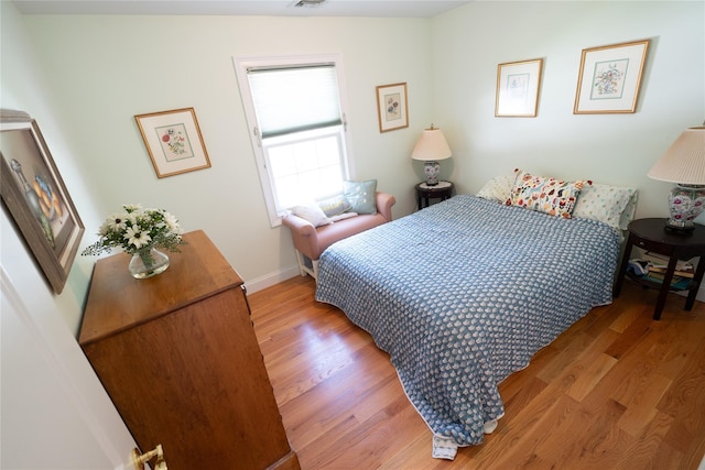 14 Gordon Ave, Plainview, NY 11803 - bedroom with light wood-style floors and baseboards