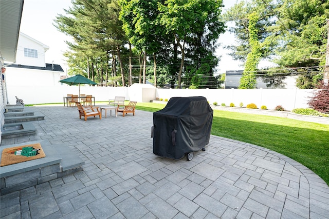 14 Gordon Ave, Plainview, NY 11803 - view of patio featuring a grill and a fire pit