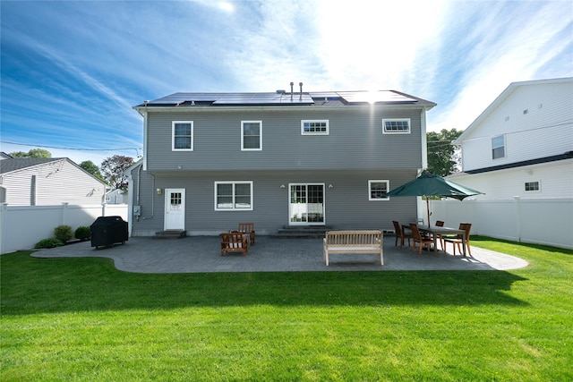 14 Gordon Ave, Plainview, NY 11803 - back of house with entry steps, roof mounted solar panels, and a patio area