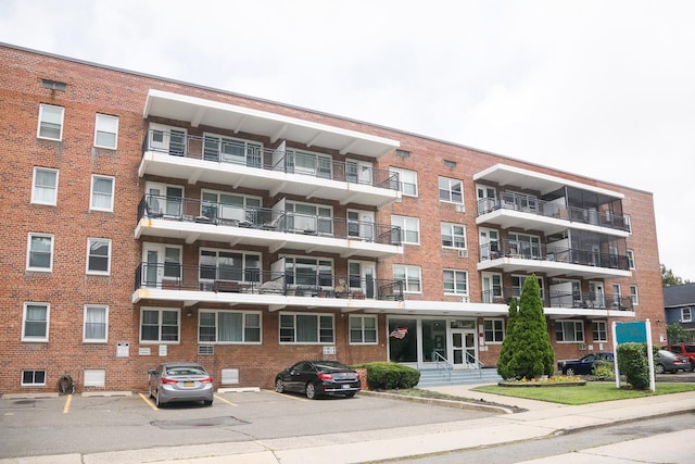 100 Randall Ave Unit 4J, Freeport, NY 11520 - view of apartment building / complex with uncovered parking