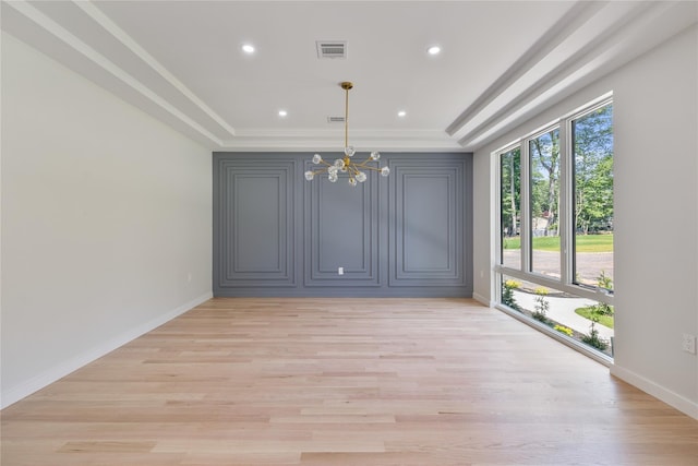 615 Union Rd, Spring Valley, NY 10977 - spare room featuring a chandelier, a tray ceiling, light wood-style floors, recessed lighting, and crown molding