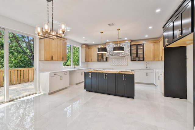 615 Union Rd, Spring Valley, NY 10977 - kitchen featuring light countertops, a chandelier, tasteful backsplash, a center island, and recessed lighting