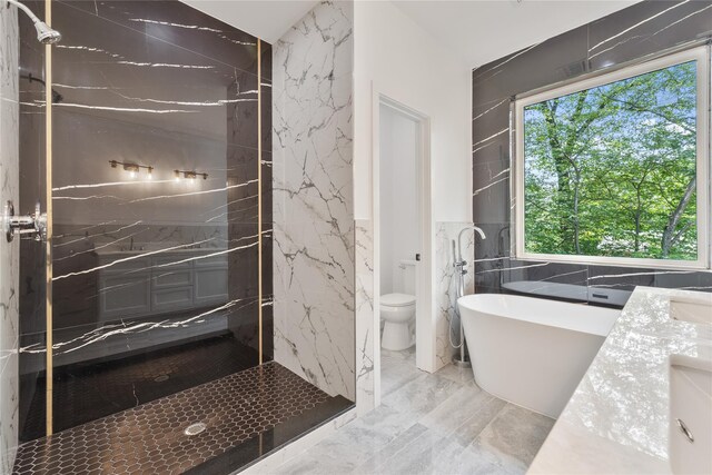 615 Union Rd, Spring Valley, NY 10977 - full bath featuring tile walls, a freestanding tub, marble tiled flooring, a marble finish shower, and vanity